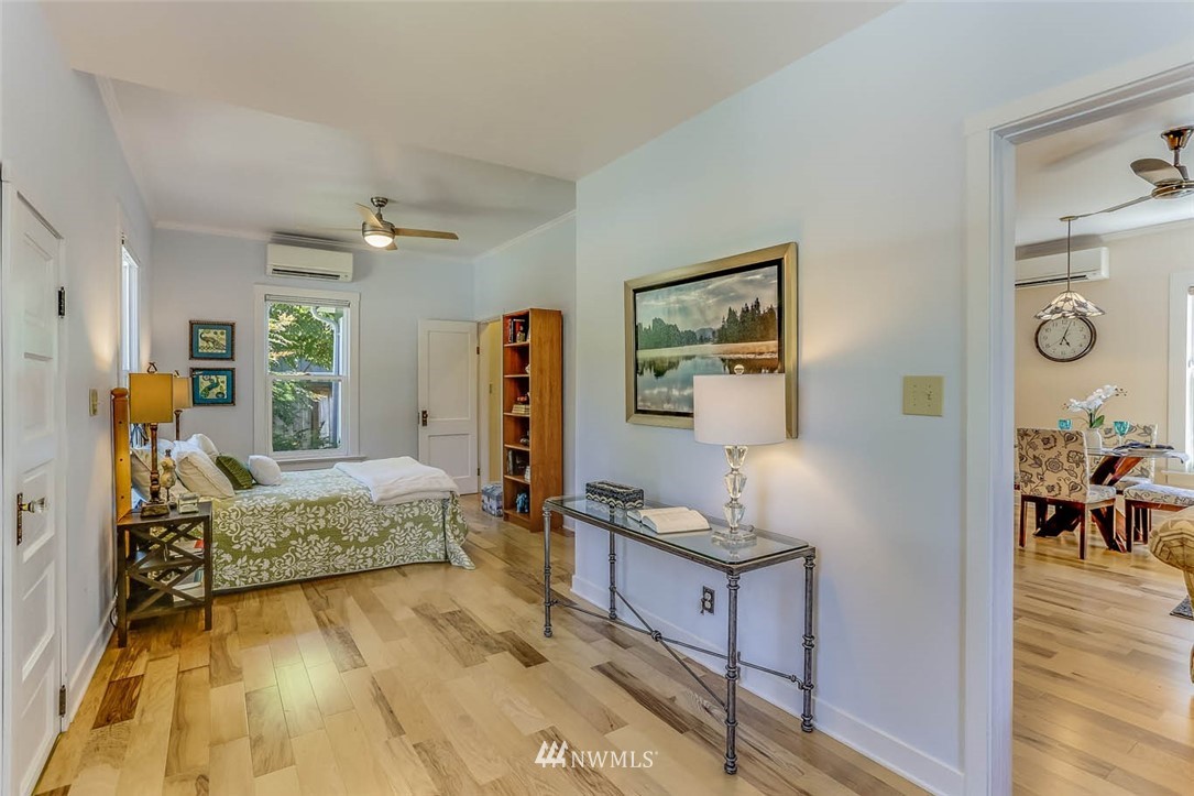 18518 103rd Avenue Northeast Bothell, WA 98011 - Photo 17 of 31 a spacious bedroom with a bed and wooden floor