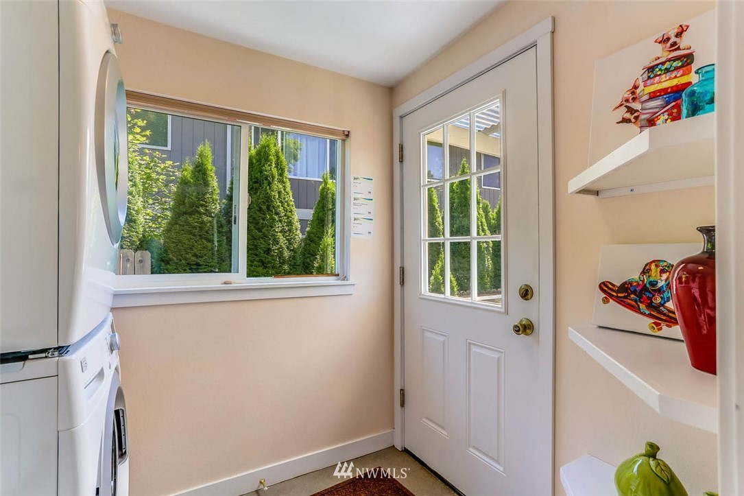 18518 103rd Avenue Northeast Bothell, WA 98011 - Photo 22 of 31 a view of a bedroom with a large window