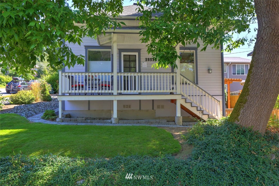 18518 103rd Avenue Northeast Bothell, WA 98011 - Photo 28 of 31 a view of a house with a deck and a yard with trees