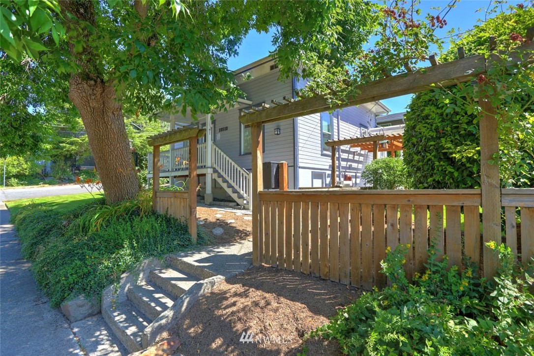 18518 103rd Avenue Northeast Bothell, WA 98011 - Photo 29 of 31 a view of a pathway of a house with a tree in the yard