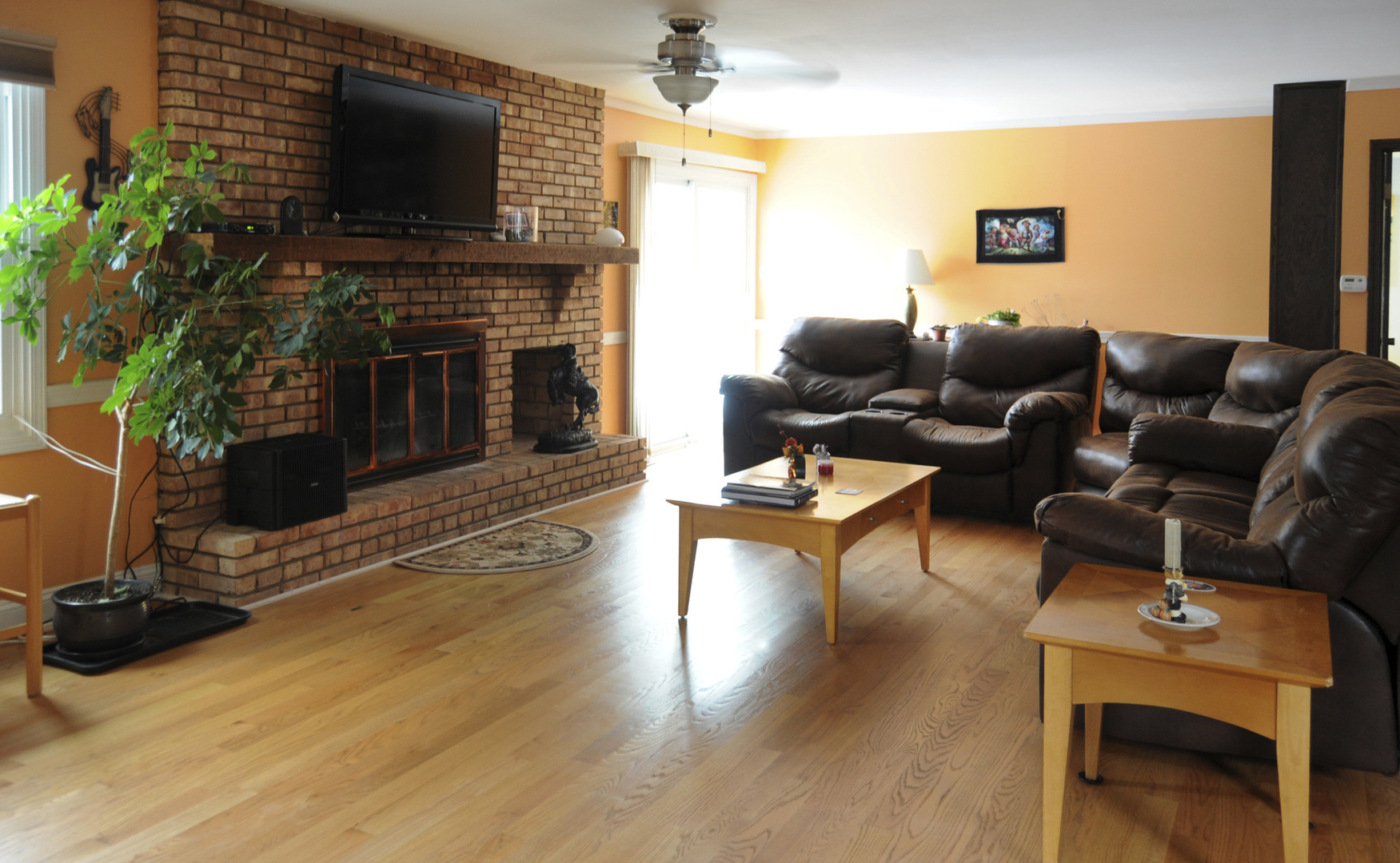280 Fairbank Road Riverside, IL 60546 - Photo 15 of 33 a living room with furniture a flat screen tv and a fireplace