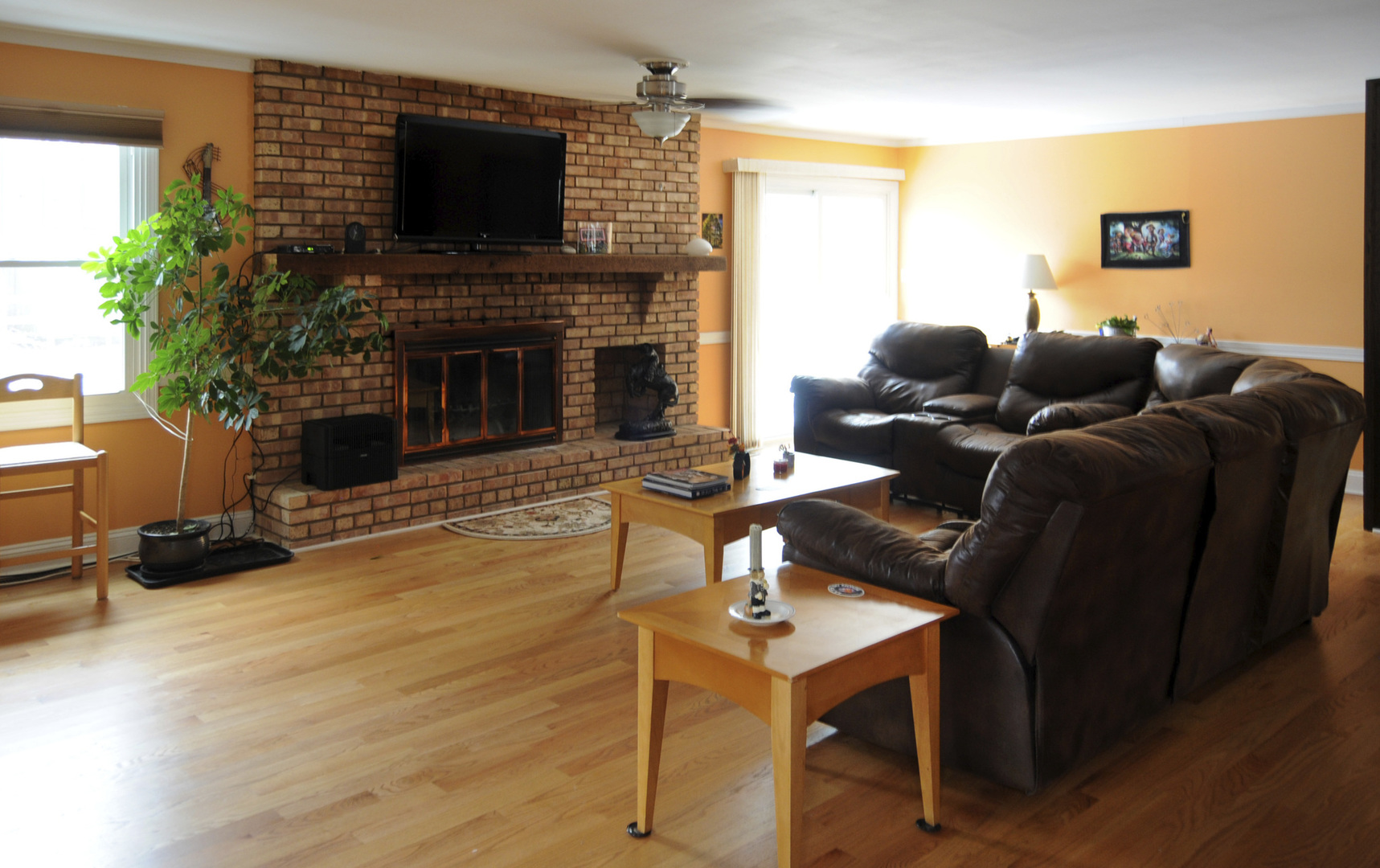 280 Fairbank Road Riverside, IL 60546 - Photo 16 of 33 a living room with furniture a flat screen tv and a fireplace