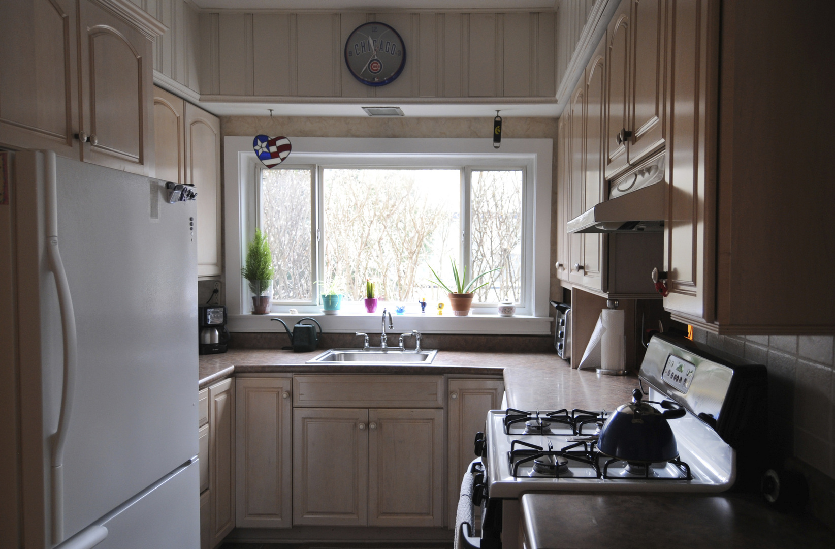 280 Fairbank Road Riverside, IL 60546 - Photo 10 of 33 a kitchen with a sink appliances cabinets and a large window