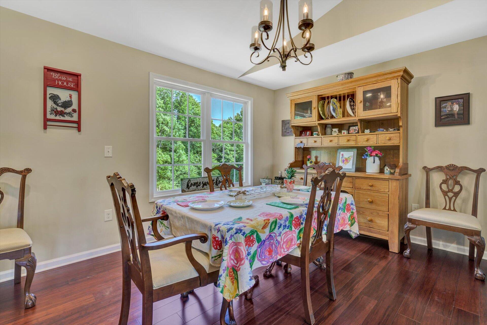 3294 Ayers Road Moneta, VA 24121 - Photo 12 of 41 a view of a dining room with furniture window and wooden floor