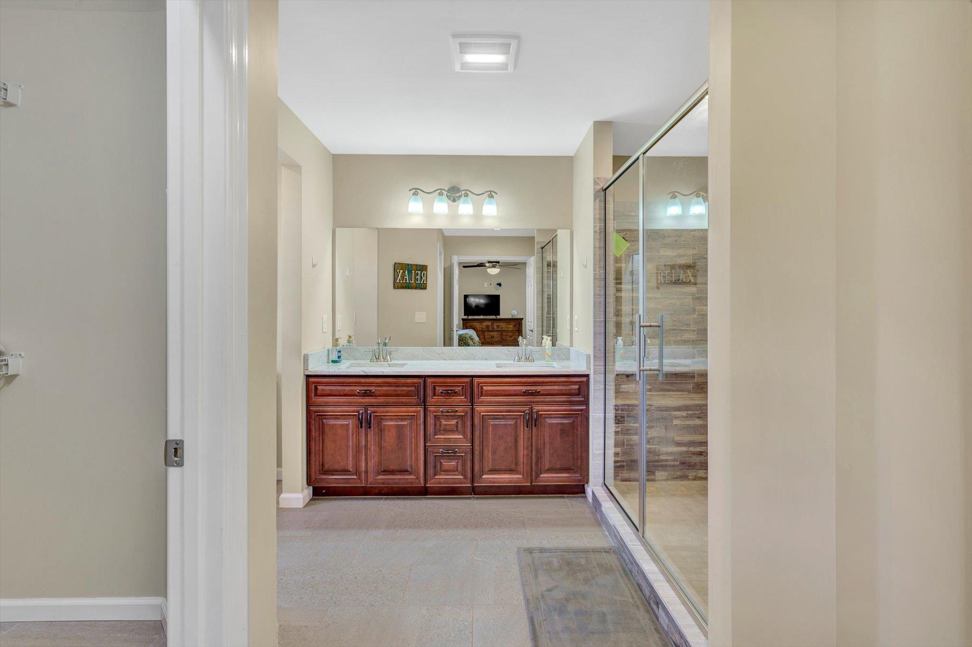 3294 Ayers Road Moneta, VA 24121 - Photo 15 of 41 a large bathroom with a glass door shower and sink