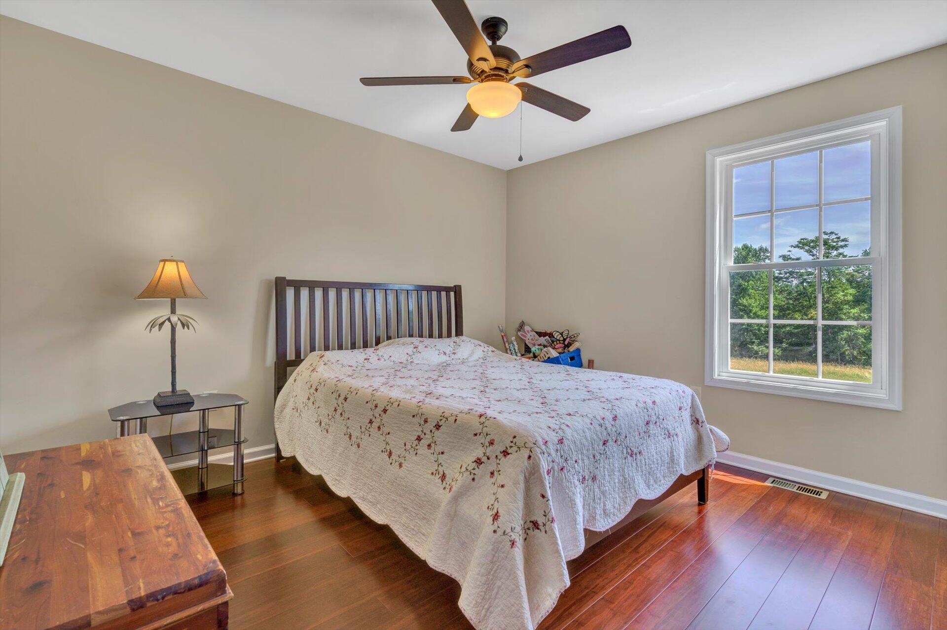 3294 Ayers Road Moneta, VA 24121 - Photo 18 of 41 a bedroom with bed and window
