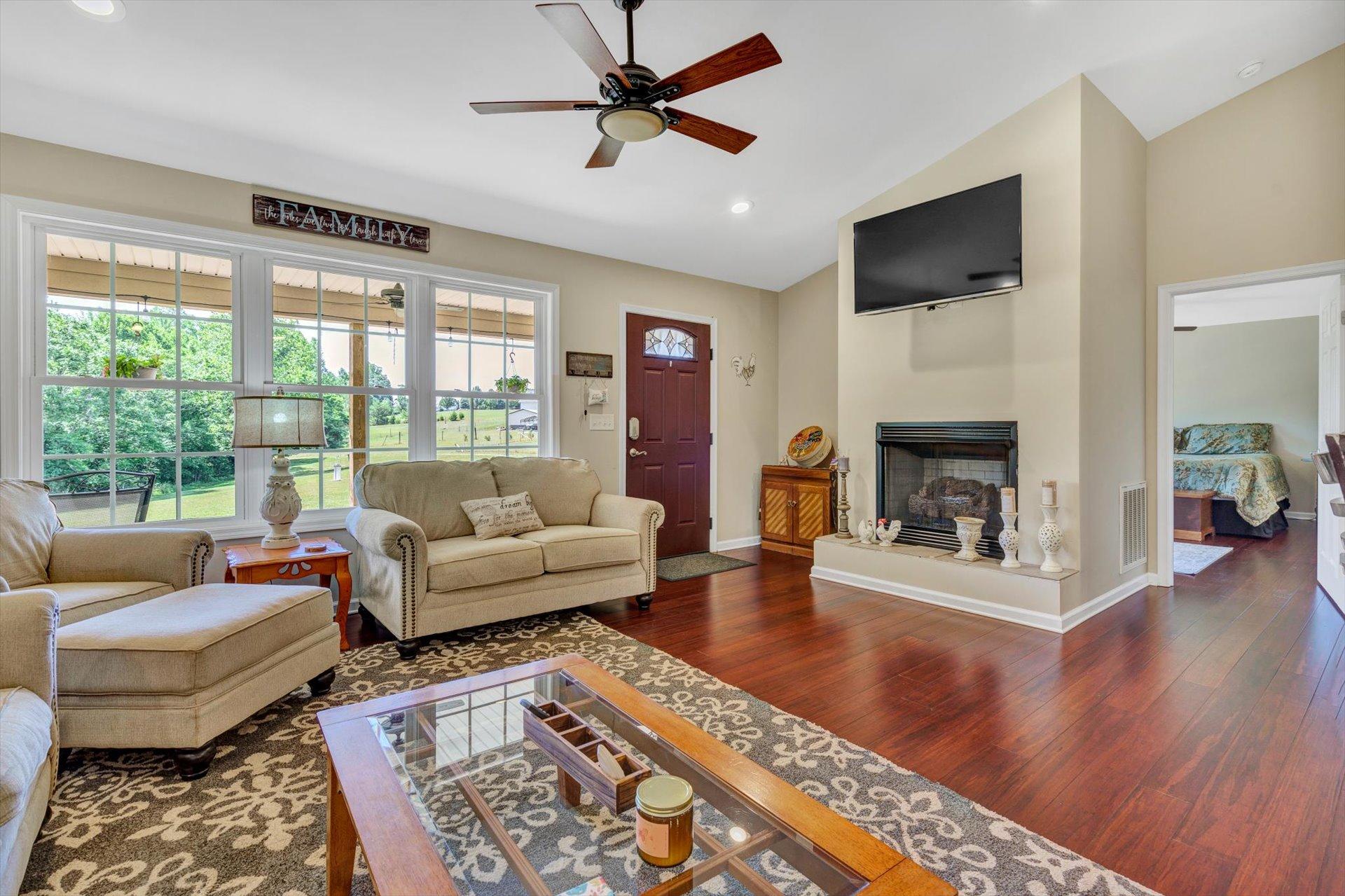 3294 Ayers Road Moneta, VA 24121 - Photo 6 of 41 a living room with furniture and a fireplace