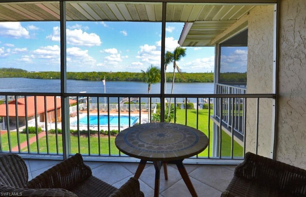 a view of a chairs and table in the patio
