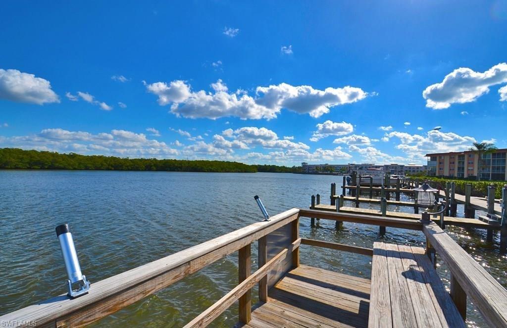 307 Goodlette-Frank Road, Unit 506B Naples, FL 34102 - Photo 25 of 25 a view of a lake from a balcony