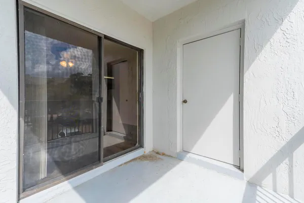 a view of a bathroom with a glass door