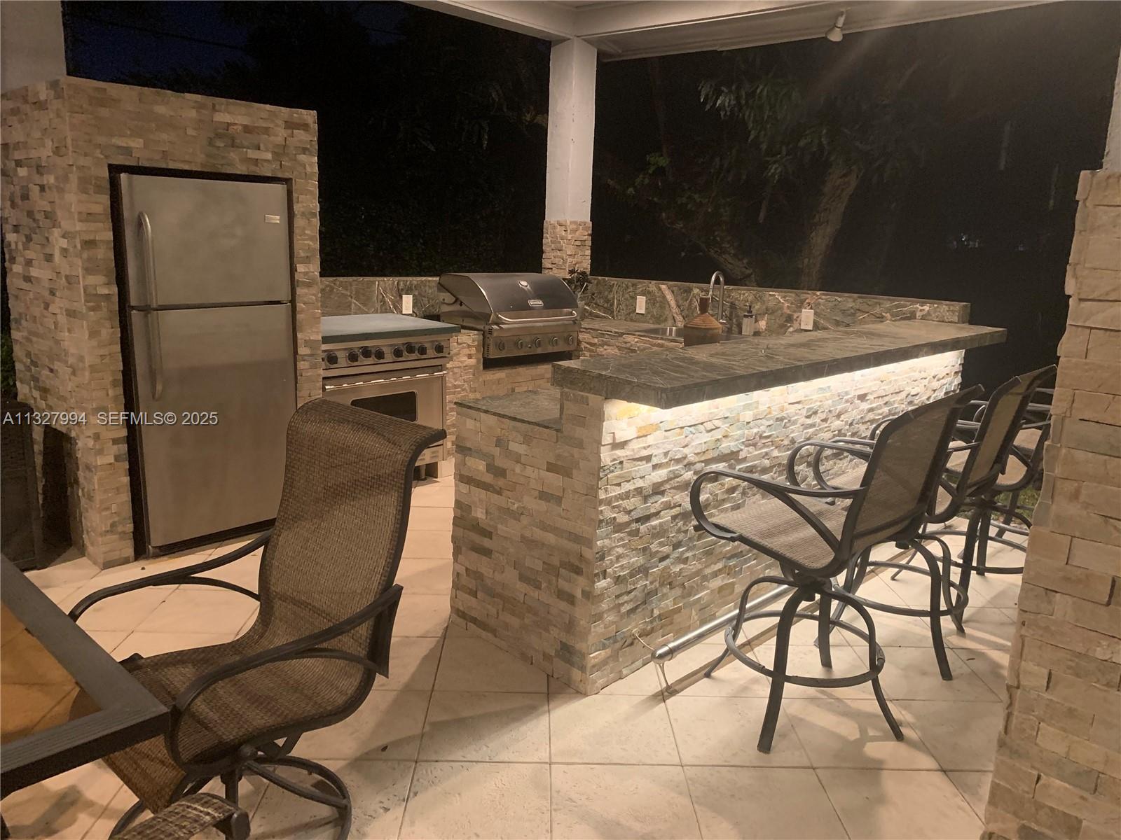 7625 Southwest 75th Avenue Miami, FL 33143 - Photo 18 of 43 Summer Kitchen Night View