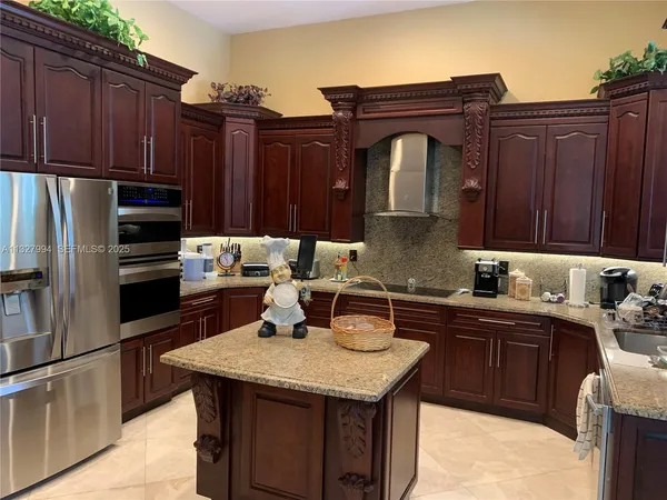 a kitchen with a stove a table and chairs