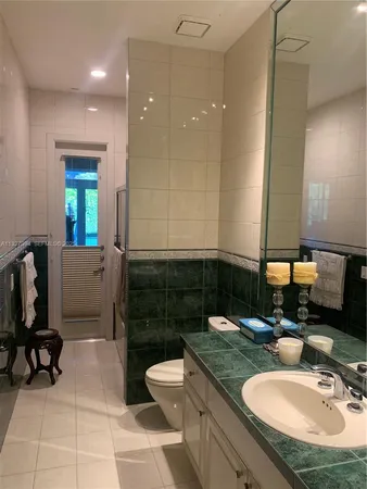 a bedroom with furniture and a flat tv screen