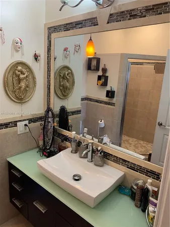 a bathroom with a sink and a mirror
