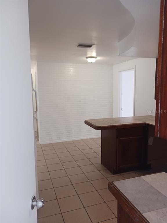 3432 Thorny Ridge Drive Holiday, FL 34691 - Photo 11 of 12 a bathroom with a sink and a mirror