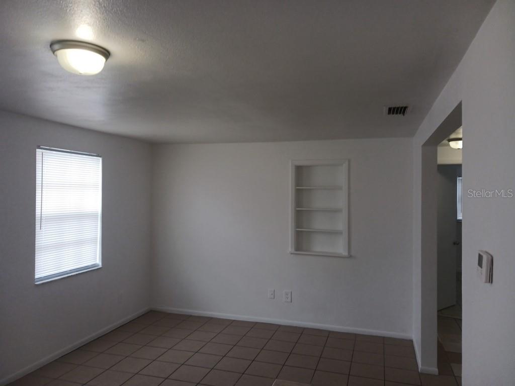 3432 Thorny Ridge Drive Holiday, FL 34691 - Photo 10 of 12 an empty room with a empty space and windows