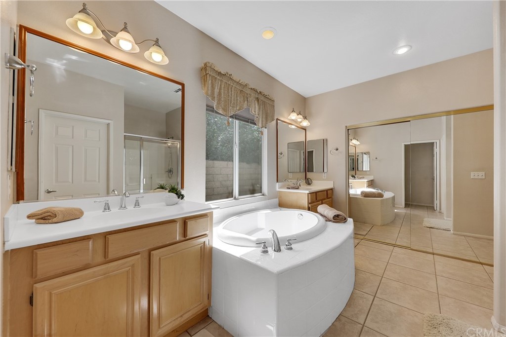82551 Grant Drive Indio, CA 92201 - Photo 19 of 45 a bathroom with a sink double vanity and a mirror