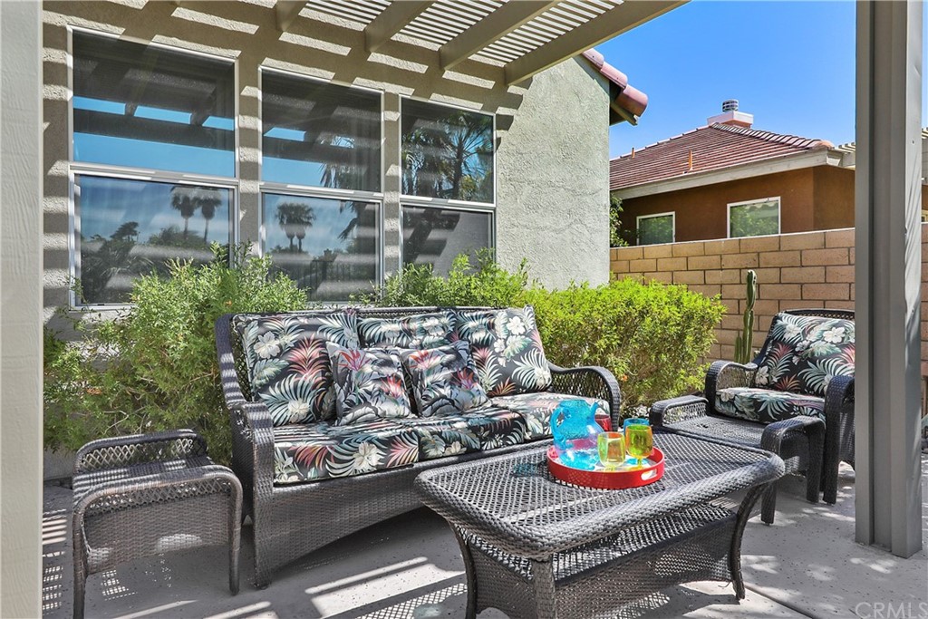 82551 Grant Drive Indio, CA 92201 - Photo 22 of 45 Patio cover gathering space next to pool