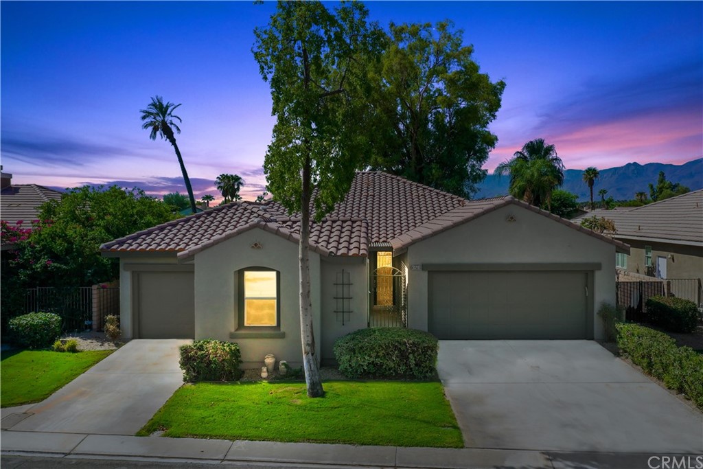 82551 Grant Drive Indio, CA 92201 - Photo 3 of 45 a front view of a house with garden