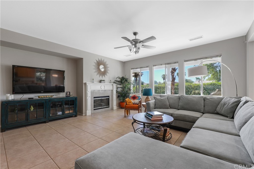 82551 Grant Drive Indio, CA 92201 - Photo 7 of 45 a living room with furniture and a flat screen tv