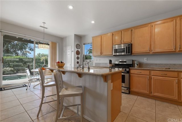 a bedroom with a bed and a table