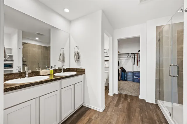 a en suite bathroom with a sink and mirror
