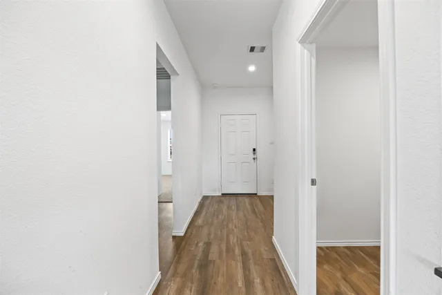 a view of a bathroom from a hallway