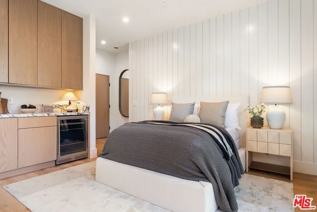 a bedroom with a bed and a cabinets