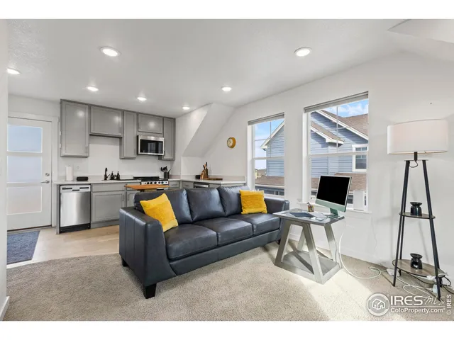 a living room with a couch and a flat screen tv