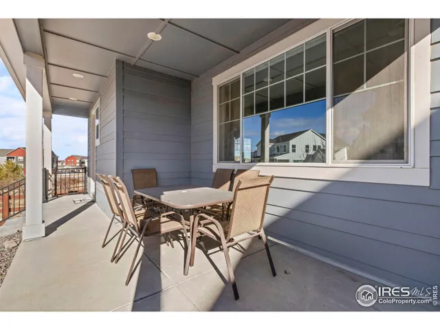 a view of a dining room with furniture and a window
