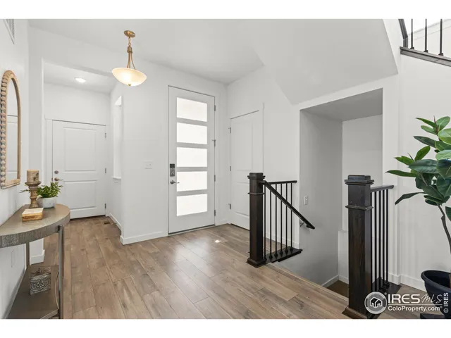 a view interior of a house with wooden floor and a chandelier