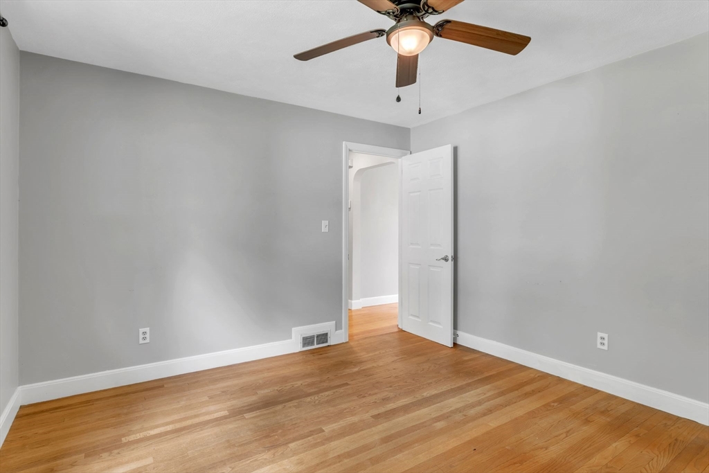 97 Old Brook Road Springfield, MA 01118 - Photo 17 of 42 an empty room with a ceiling fan