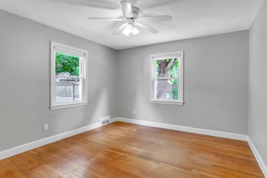 97 Old Brook Road Springfield, MA 01118 - Photo 19 of 42 a view of empty room with wooden floor and fan