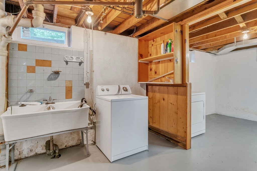 97 Old Brook Road Springfield, MA 01118 - Photo 34 of 42 a utility room with dryer and washer