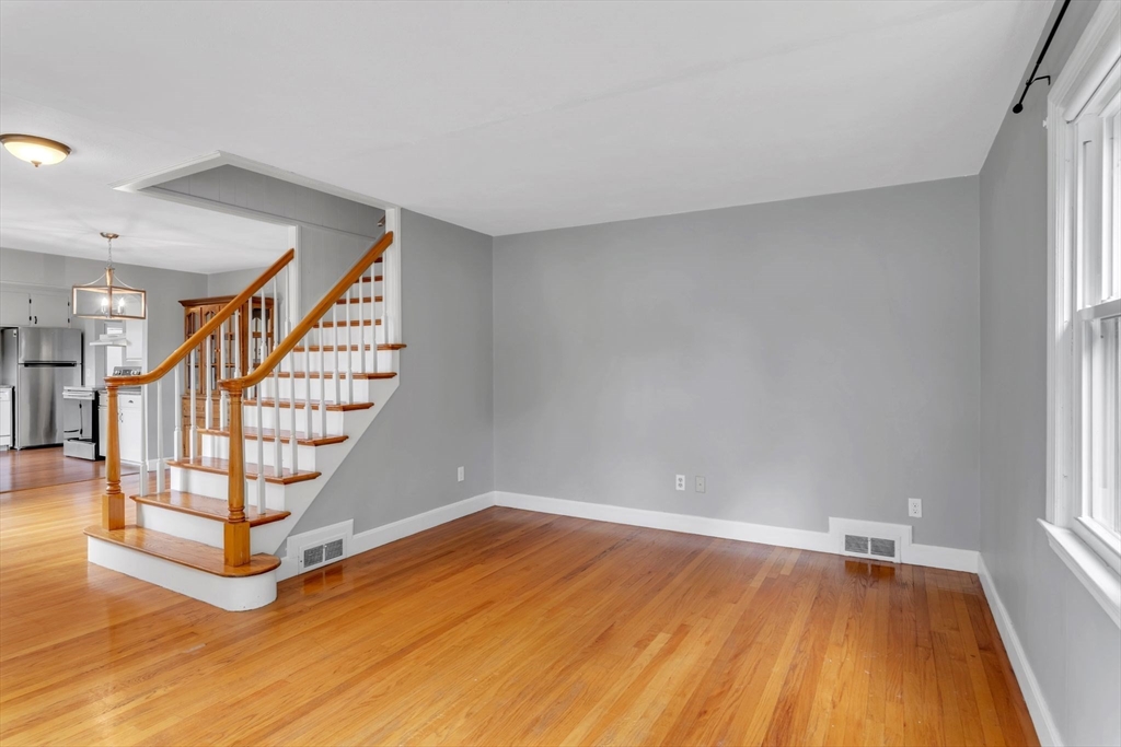 97 Old Brook Road Springfield, MA 01118 - Photo 4 of 42 a view of an empty room with stairs and wooden floor