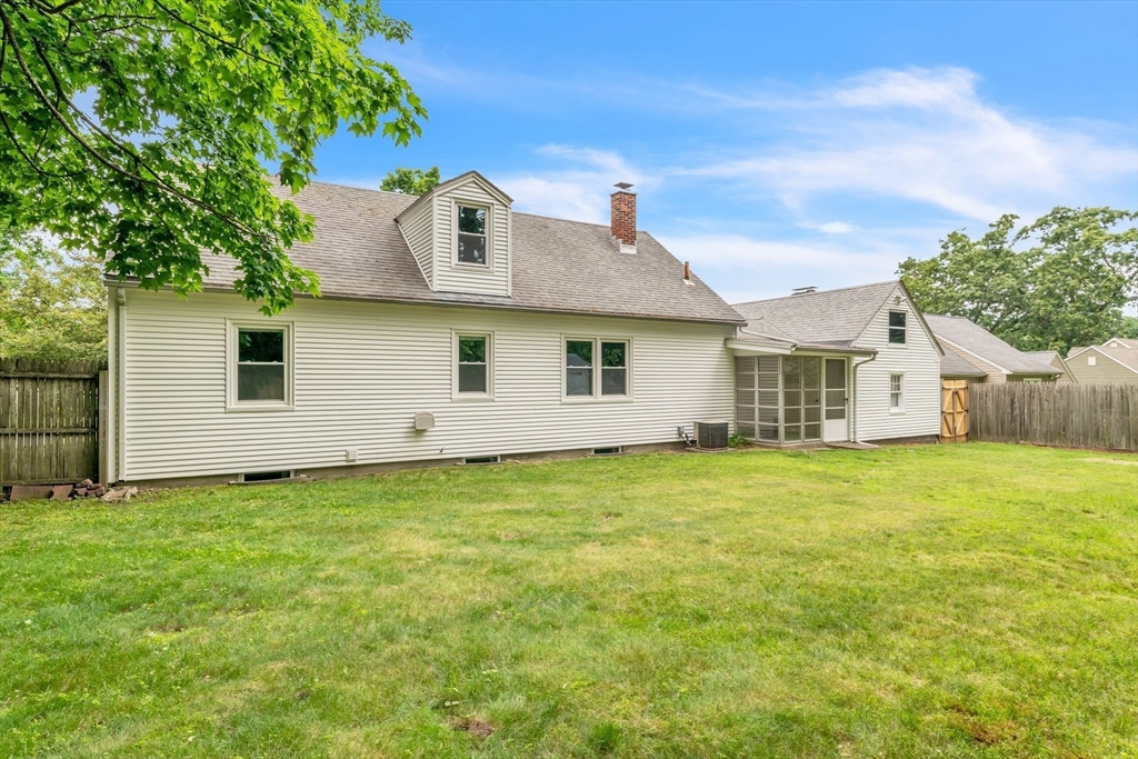 97 Old Brook Road Springfield, MA 01118 - Photo 41 of 42 a view of a backyard with plants and a large tree