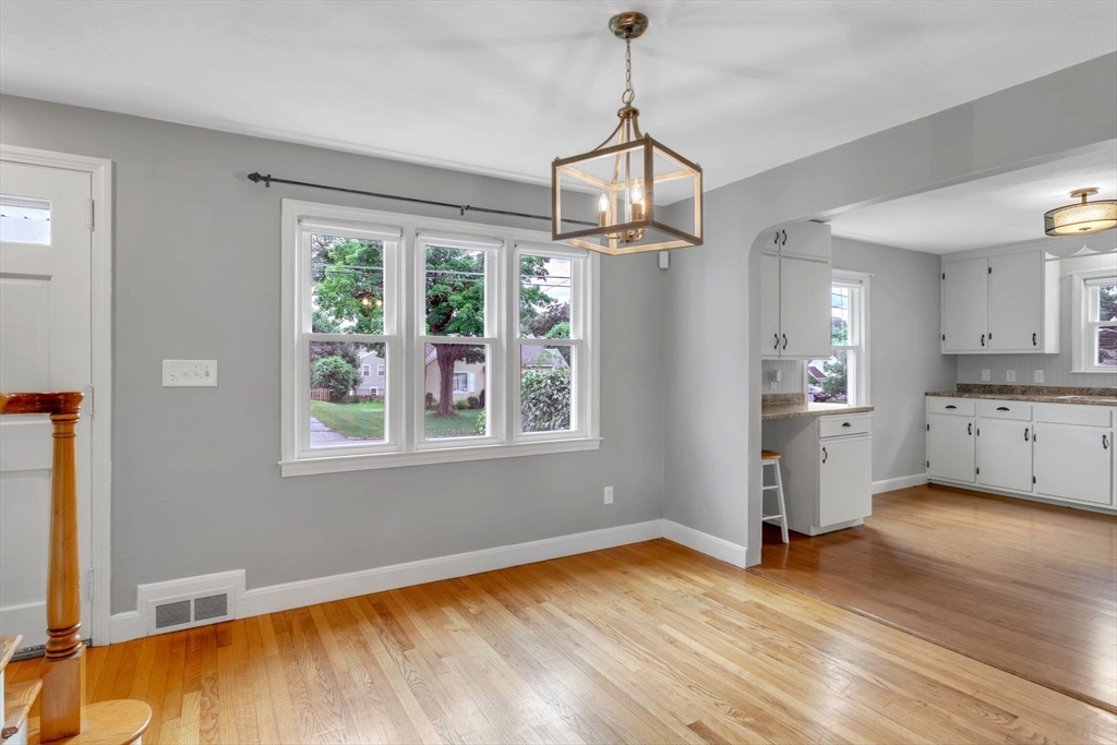 97 Old Brook Road Springfield, MA 01118 - Photo 9 of 42 a view of a kitchen with wooden floor and windows