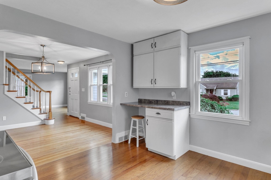 97 Old Brook Road Springfield, MA 01118 - Photo 10 of 42 a kitchen with stainless steel appliances granite countertop a stove and a wooden floors