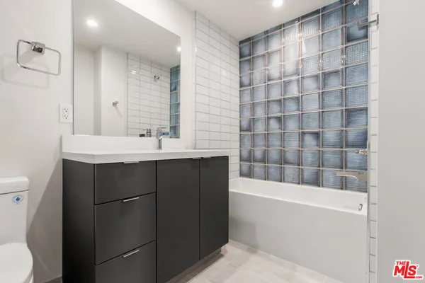 a bathroom with a sink and a bathtub