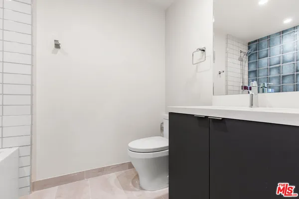 a bathroom with a sink and a toilet