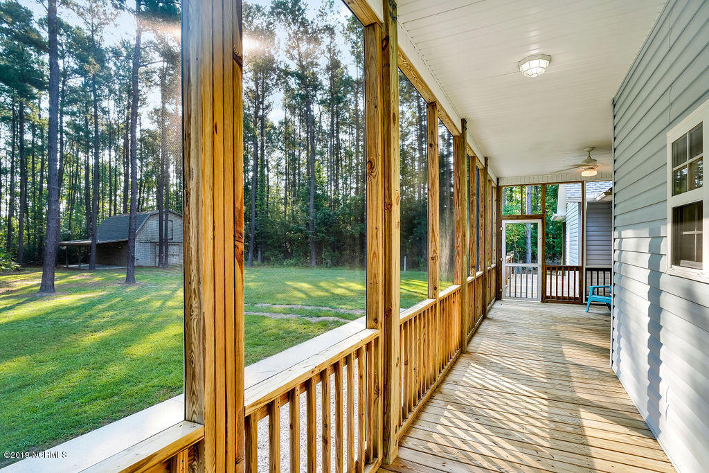 780 McKay Road Southeast Bolivia, NC 28422 - Photo 18 of 42 Screen porch leads onto back deck