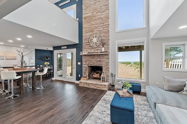 a living room with furniture and a fireplace