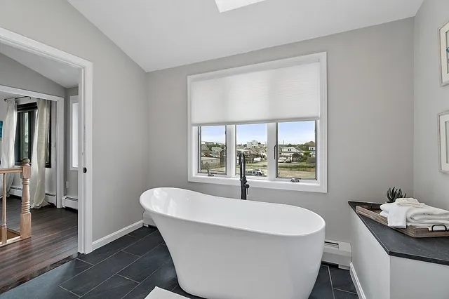 a living room with couch and a window