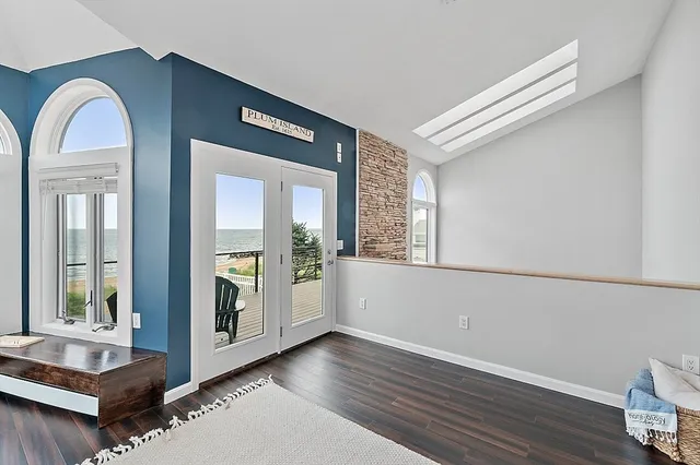 a view of entryway with wooden floor