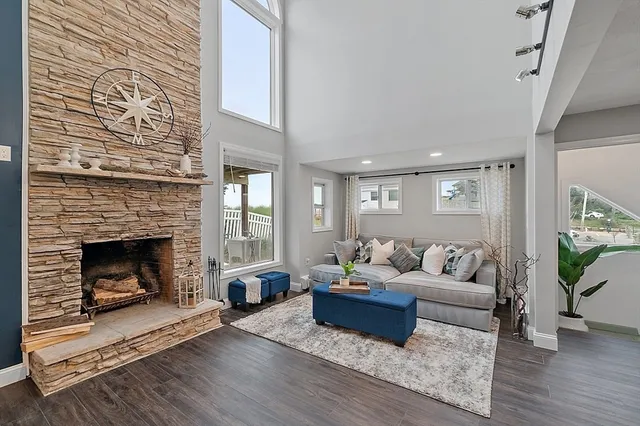 a living room with furniture and a fireplace