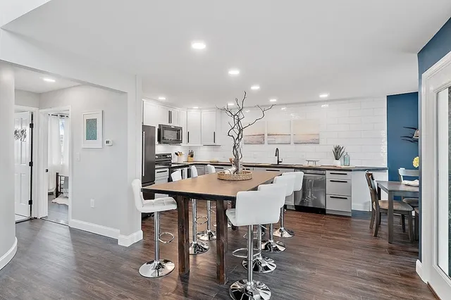 a kitchen with a table and chairs in it