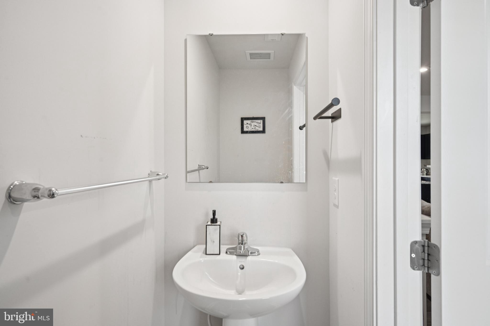 21 Mulberry Lane Clementon, NJ 08021 - Photo 17 of 39 a bathroom with a sink and a mirror