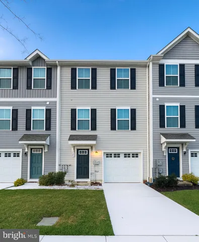 a front view of building with yard