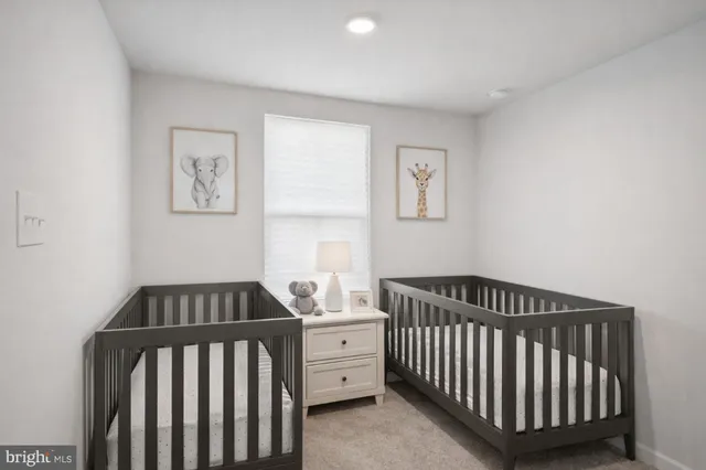 a bedroom with a white bed and a window