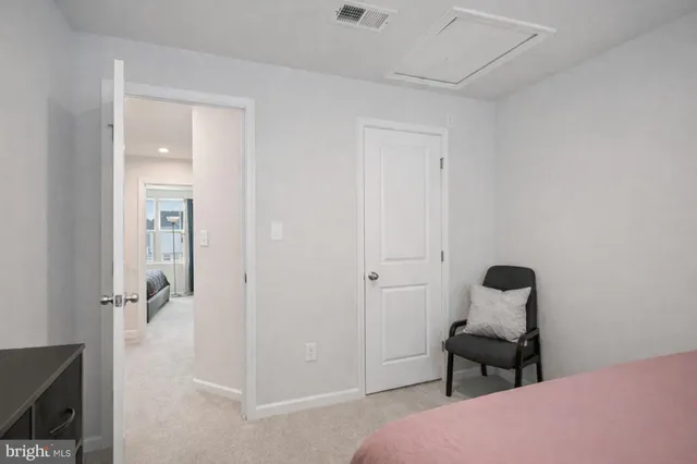 a bedroom with a bed and a mirror